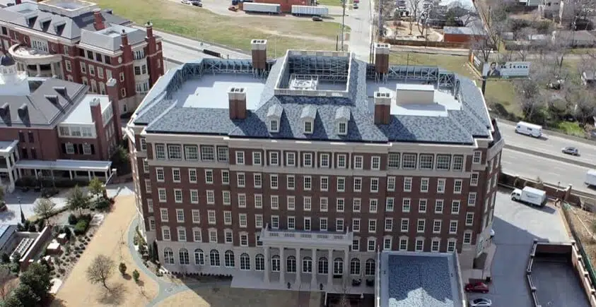 Trammel Crow Campus Historical Parkland Hospital with shingle roofing, installed by Alpine Roofing Construction