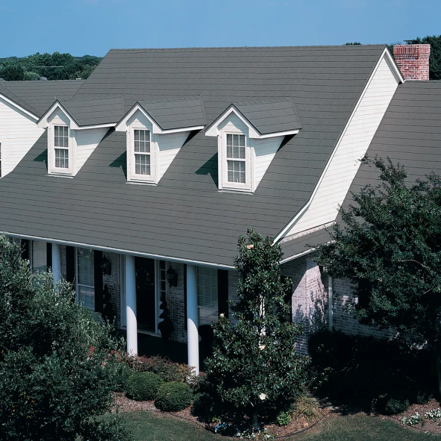 A home built with a roof made out of Tamko Metalworks Astonwood panels, colored a slate grey