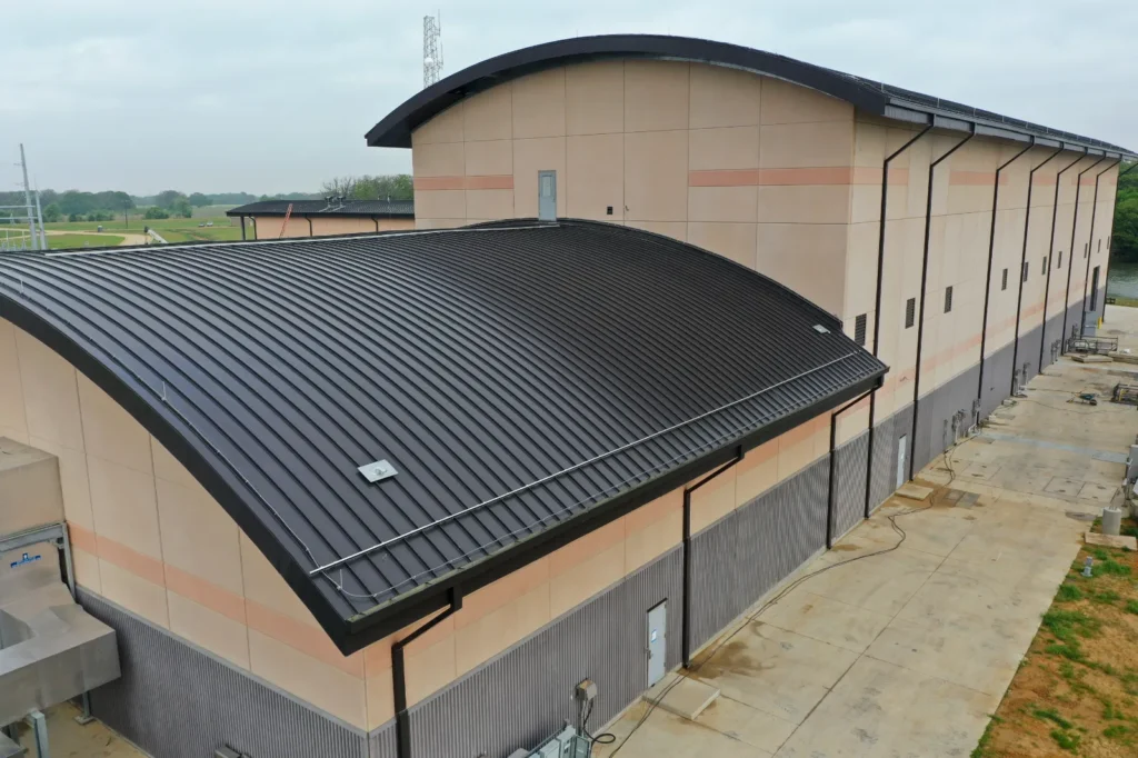 Commercial metal roof installation in Dallas, TX bu Alpine Roofing Construction.